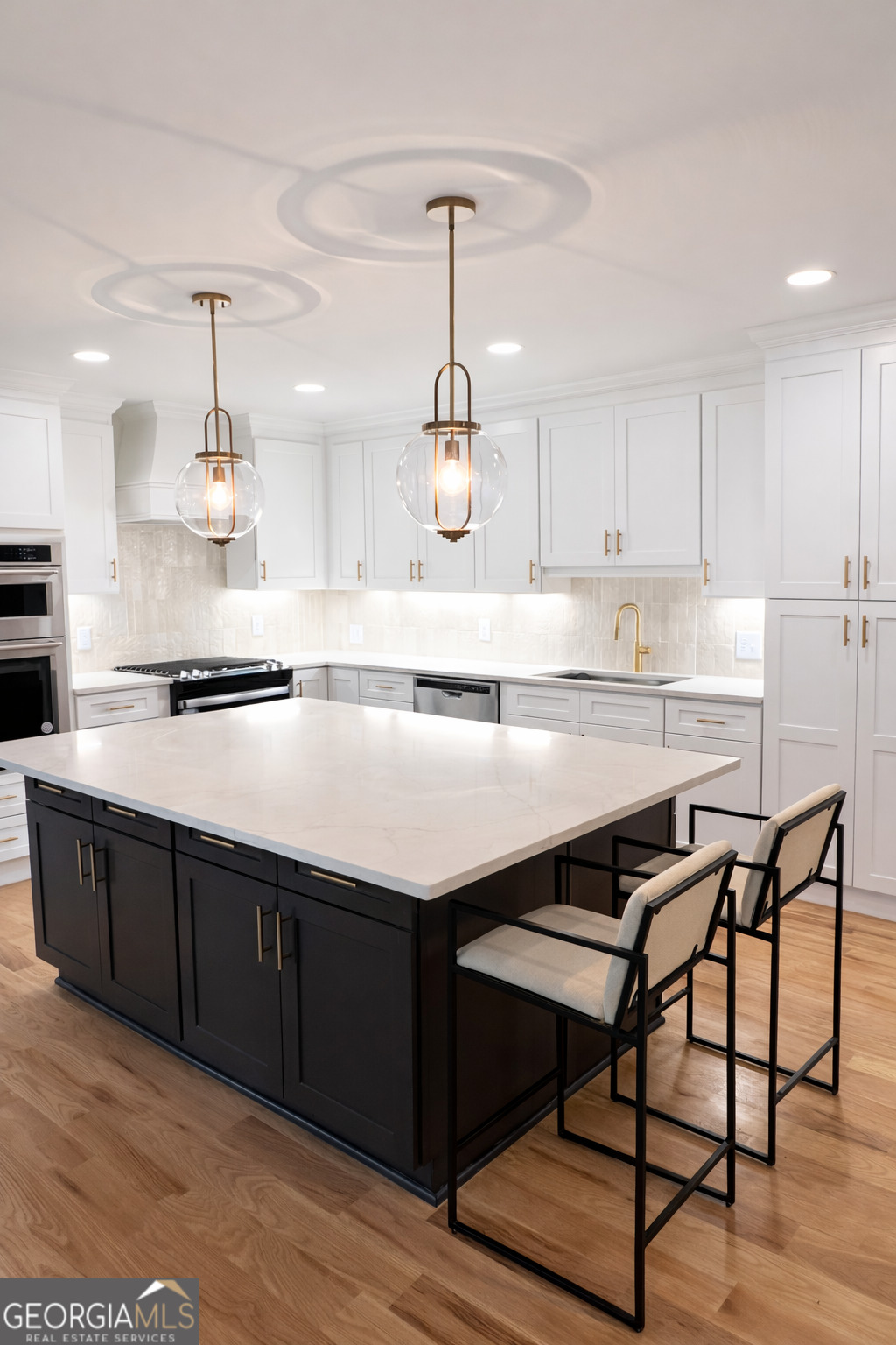 3045 Hitt Road Cumming, GA 30041 - Photo 9 of 46 a kitchen with stainless steel appliances granite countertop a sink dishwasher a stove and white cabinets with wooden floor
