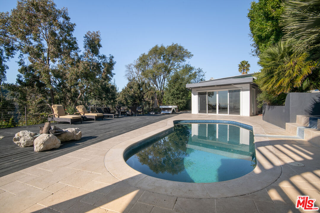 1001 Stradella Road Los Angeles, CA 90077 - Photo 24 of 28 a swimming pool view with a outdoor seating