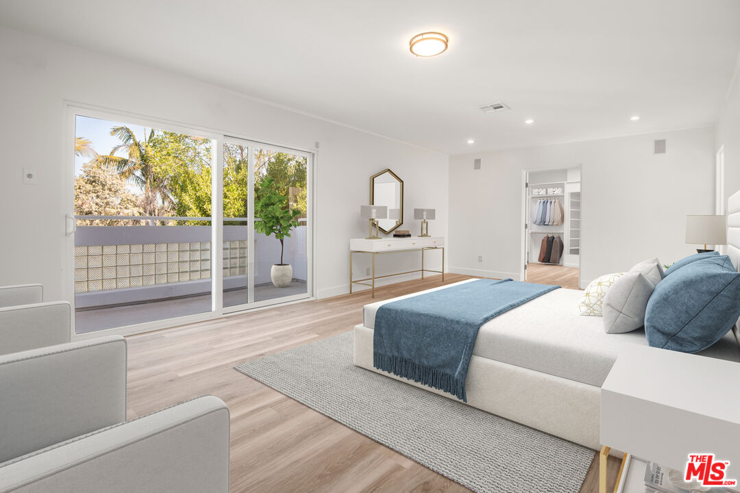1001 Stradella Road Los Angeles, CA 90077 - Photo 8 of 28 a spacious bedroom with a large bed and a large window
