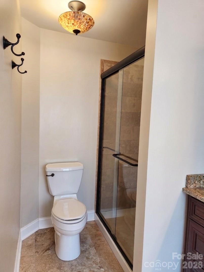 104 Rock Ridge Lane Mount Holly, NC 28120 - Photo 30 of 48 a bathroom with a toilet and a shower