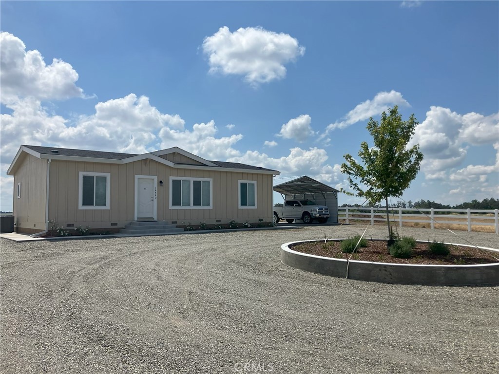14450 Meridian Road Chico, CA 95973 - Photo 2 of 37 a view of a house with a backyard and a yard