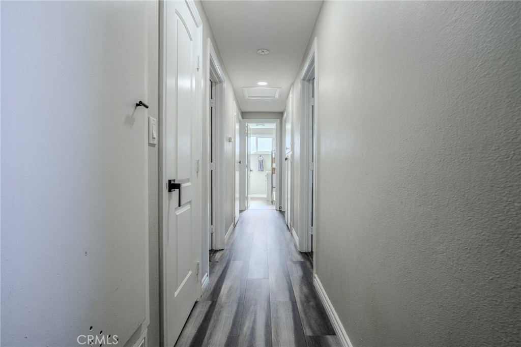 827 South Riverside Avenue Rialto, CA 92376 - Photo 18 of 60 a view of a hallway with wooden floor