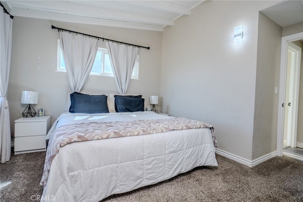 827 South Riverside Avenue Rialto, CA 92376 - Photo 25 of 60 a bedroom with a bed and window