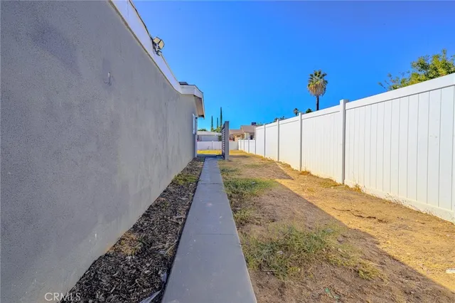 an aerial view of a house with outdoor space