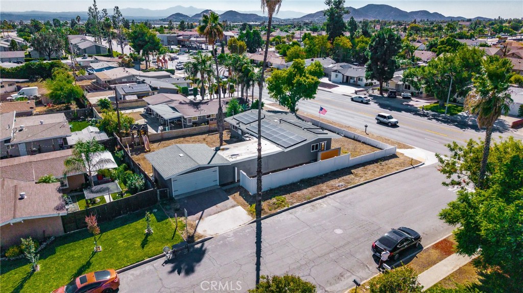827 South Riverside Avenue Rialto, CA 92376 - Photo 40 of 60 an aerial view of a house with a garden and lake view