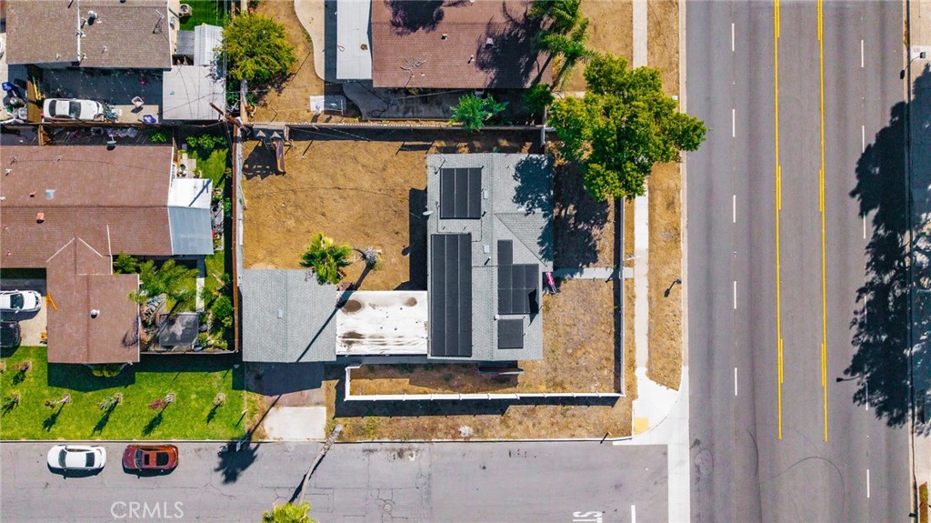 827 South Riverside Avenue Rialto, CA 92376 - Photo 47 of 60 an aerial view of a house with a garden and parking
