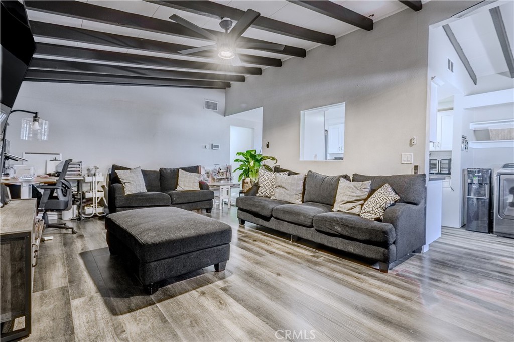 827 South Riverside Avenue Rialto, CA 92376 - Photo 8 of 60 a living room with furniture and wooden floor