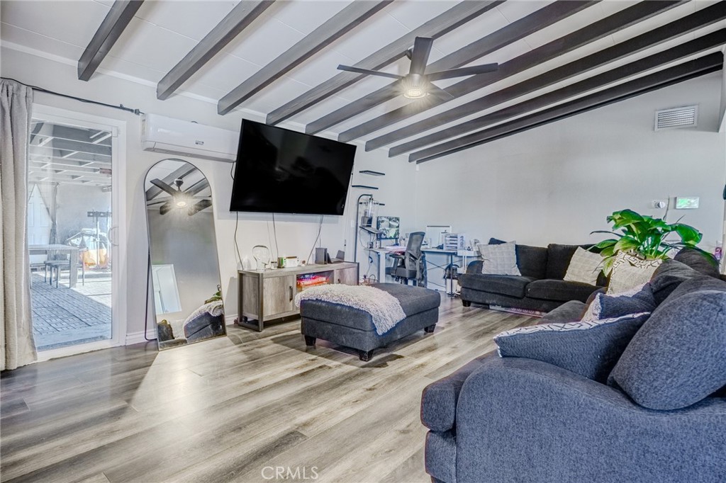 827 South Riverside Avenue Rialto, CA 92376 - Photo 9 of 60 a living room with furniture and a flat screen tv
