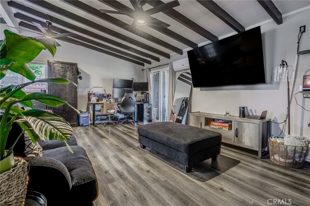 827 South Riverside Avenue Rialto, CA 92376 - Photo 10 of 60 a living room with furniture and a flat screen tv