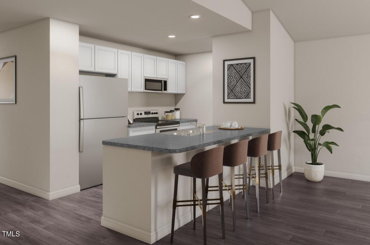 319 Maggie Lane Roxboro, NC 27573 - Photo 3 of 29 a kitchen with stainless steel appliances granite countertop a refrigerator a stove a sink a dining table and chairs with wooden floor