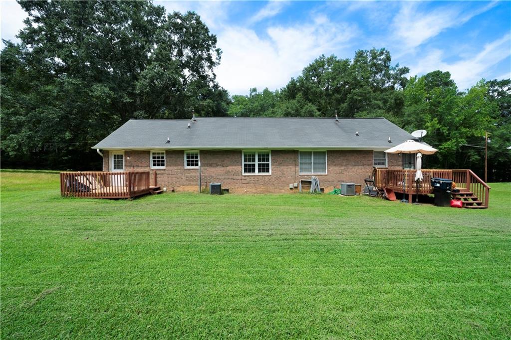 256 Powder Springs Street, Unit A Hiram, GA 30141 - Photo 16 of 16 a front view of a house with a garden