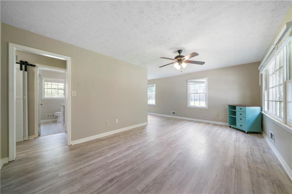 256 Powder Springs Street, Unit A Hiram, GA 30141 - Photo 2 of 16 a view of an empty room with a window and wooden floor