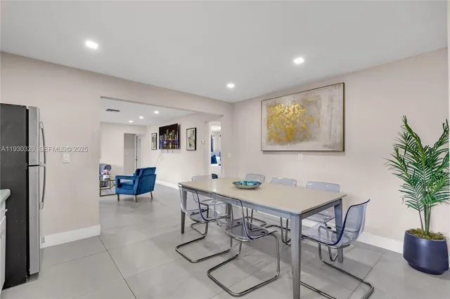 a kitchen with white cabinets and a sink