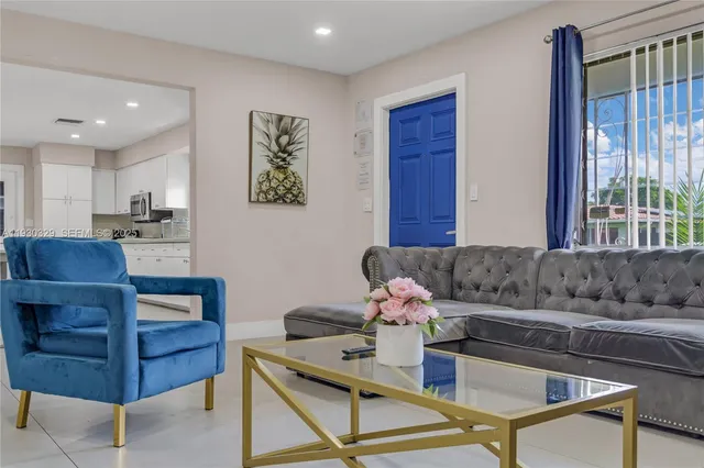 a bedroom with a large bed and a large window