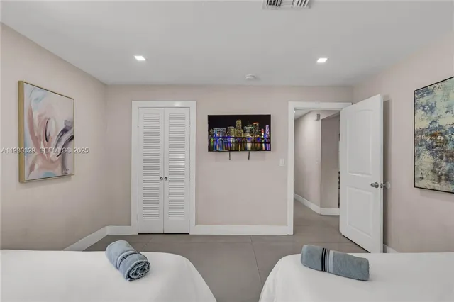 a bathroom with a glass shower door