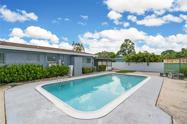 a view of a porch with furniture and a gate