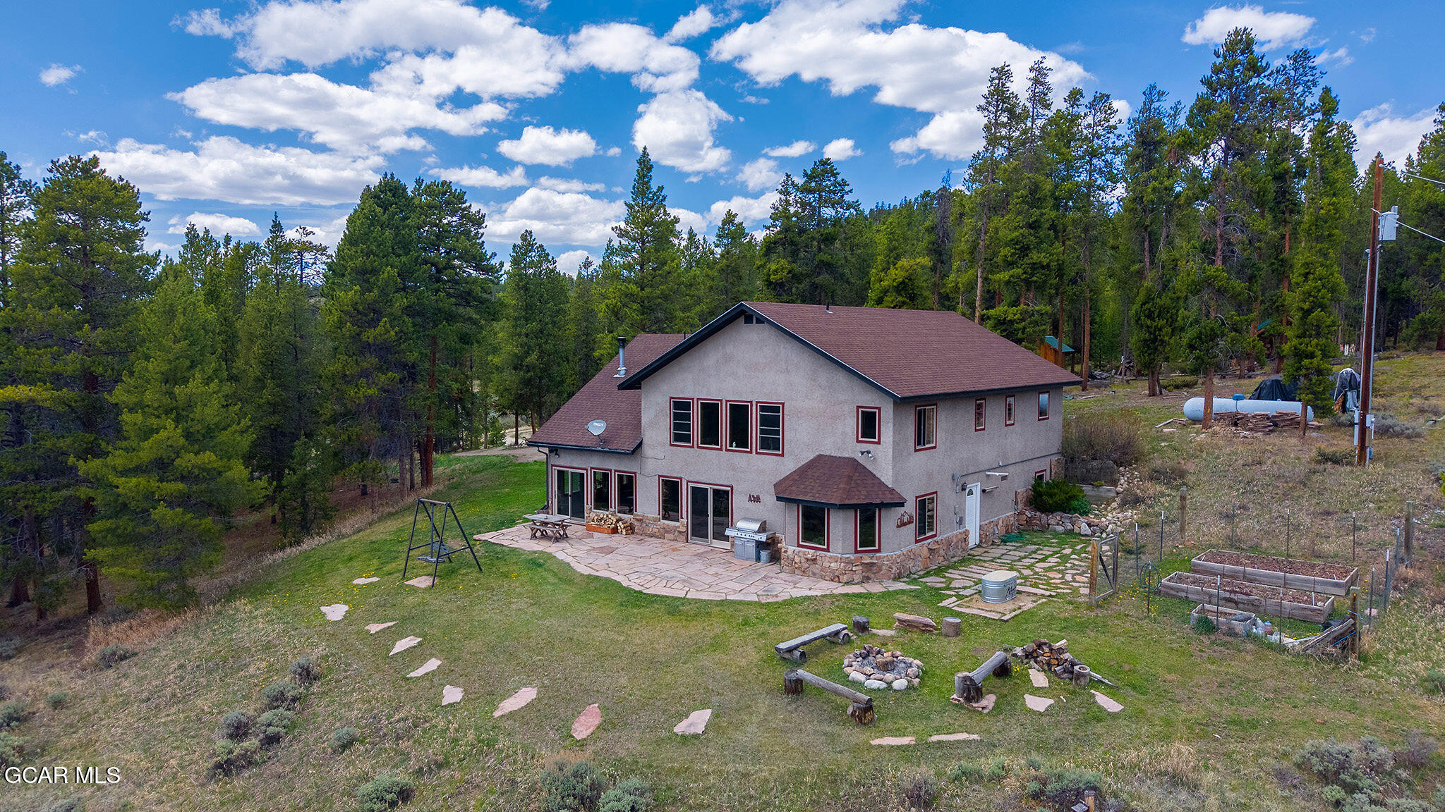 732 Gcr 8311/ Clayton Ranch Road Tabernash, CO 80478 - Photo 49 of 65 a view of a house with a big yard