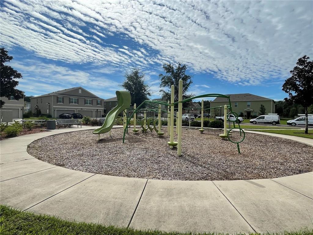3408 Seneca Club Loop, Unit A Orlando, FL 32808 - Photo 32 of 36 a view of outdoor space with playground and green space