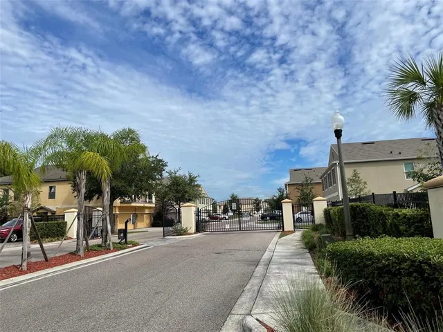 a view of a street with cars parked
