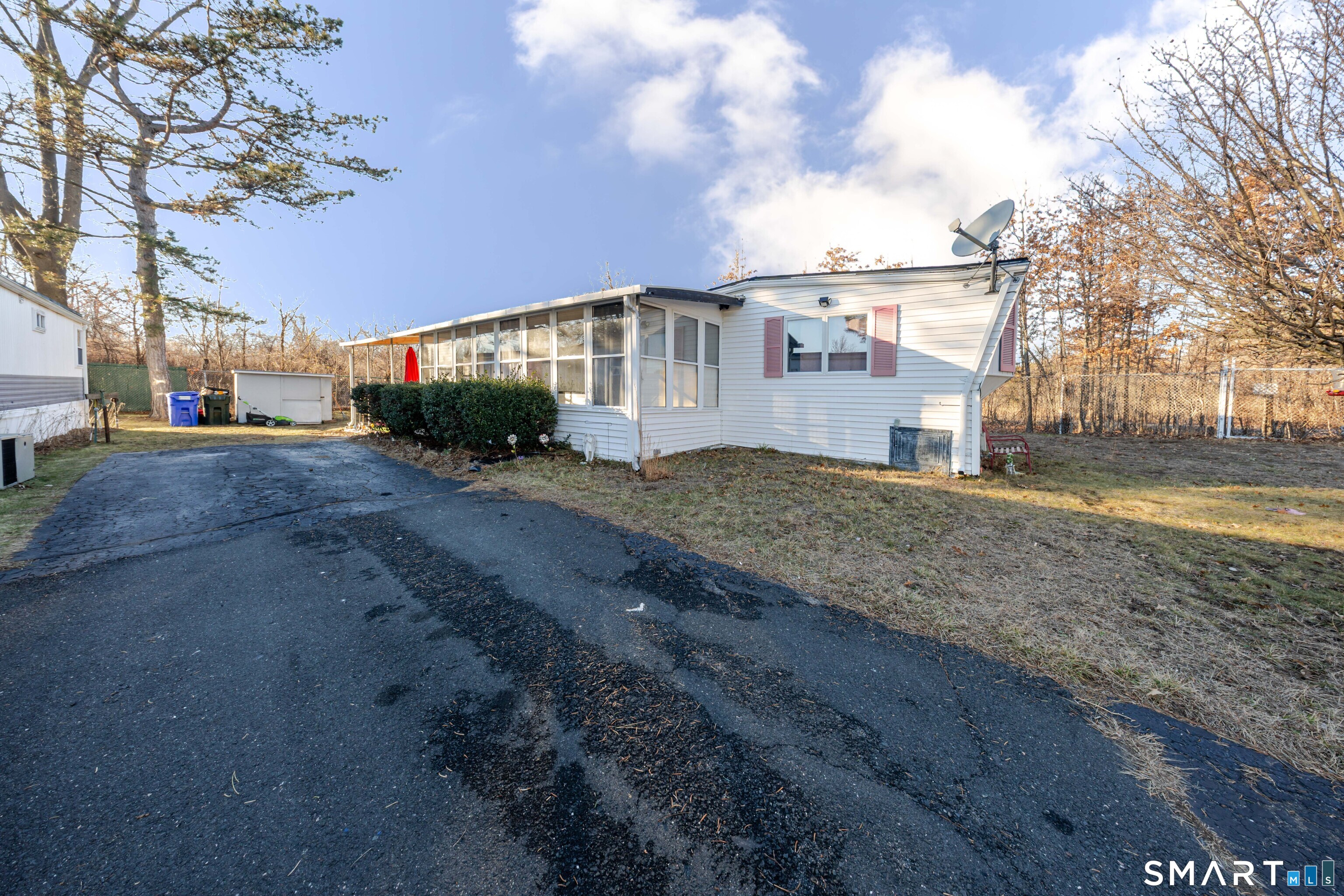 93 Shawnee Road East Hartford, CT 06118 - Photo 3 of 37 a front view of a house with a yard
