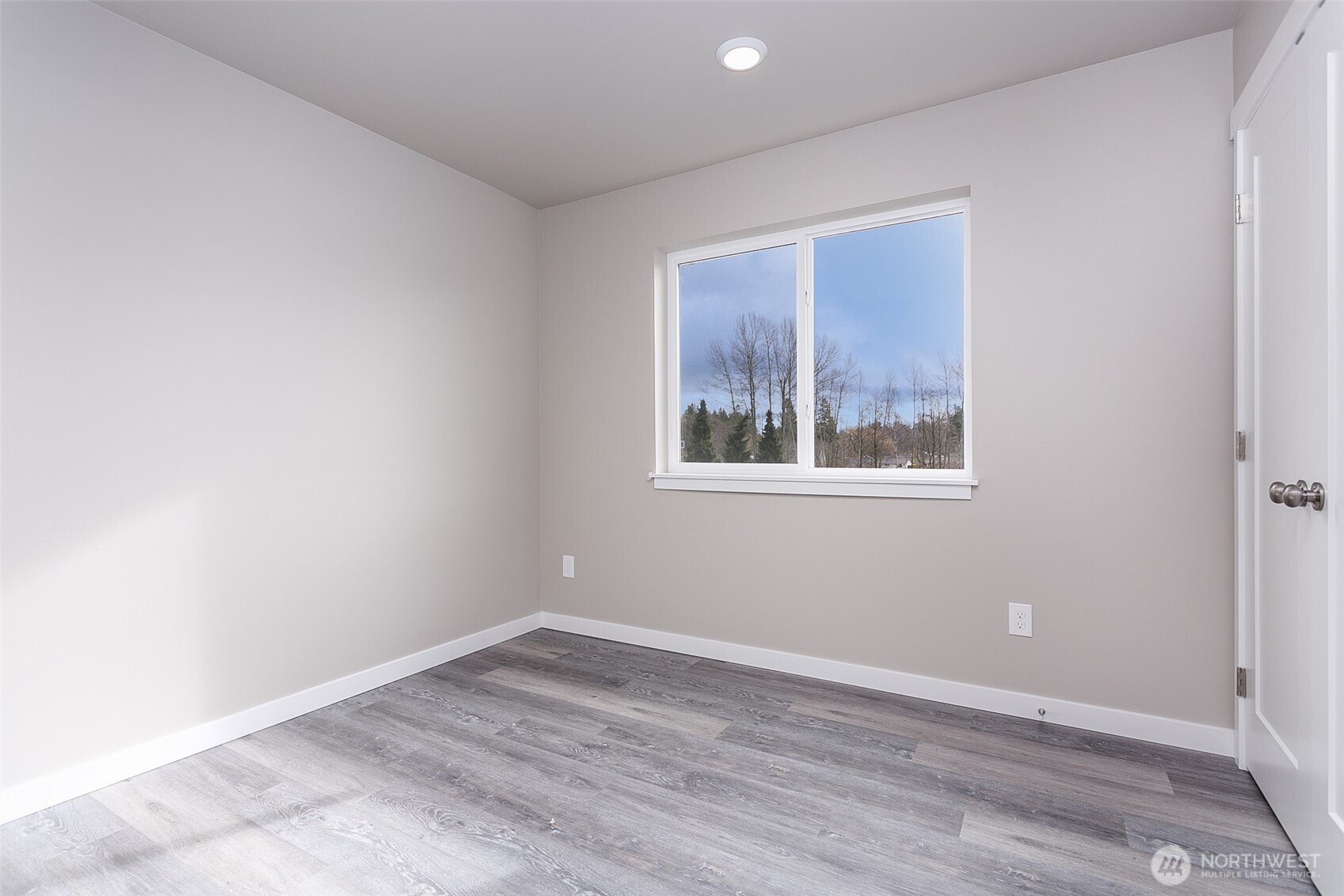 1817 Eastgate Loop Ferndale, WA 98248 - Photo 15 of 32 a view of empty room with wooden floor
