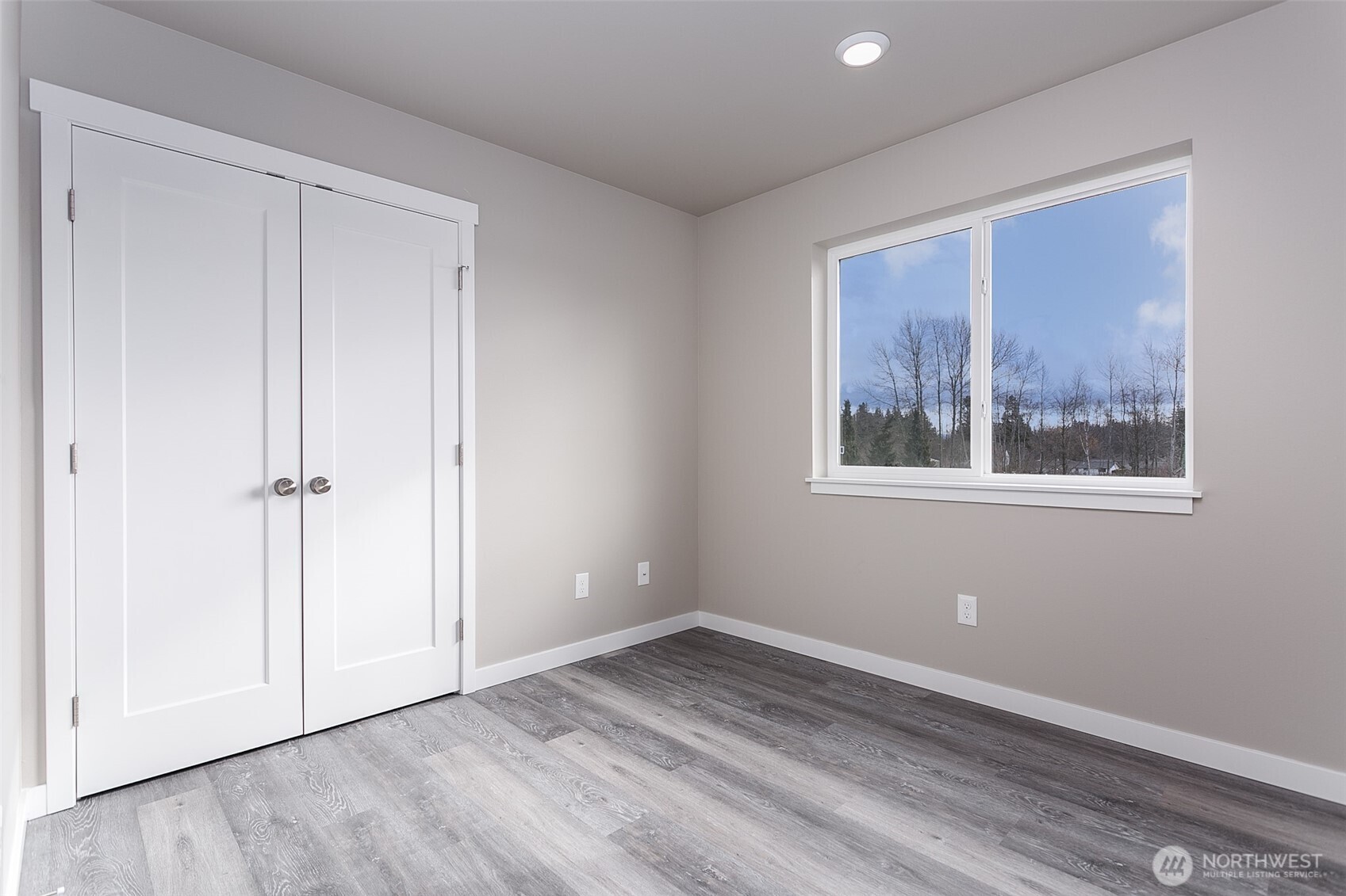 1817 Eastgate Loop Ferndale, WA 98248 - Photo 18 of 32 a view of empty room with wooden floor and fan