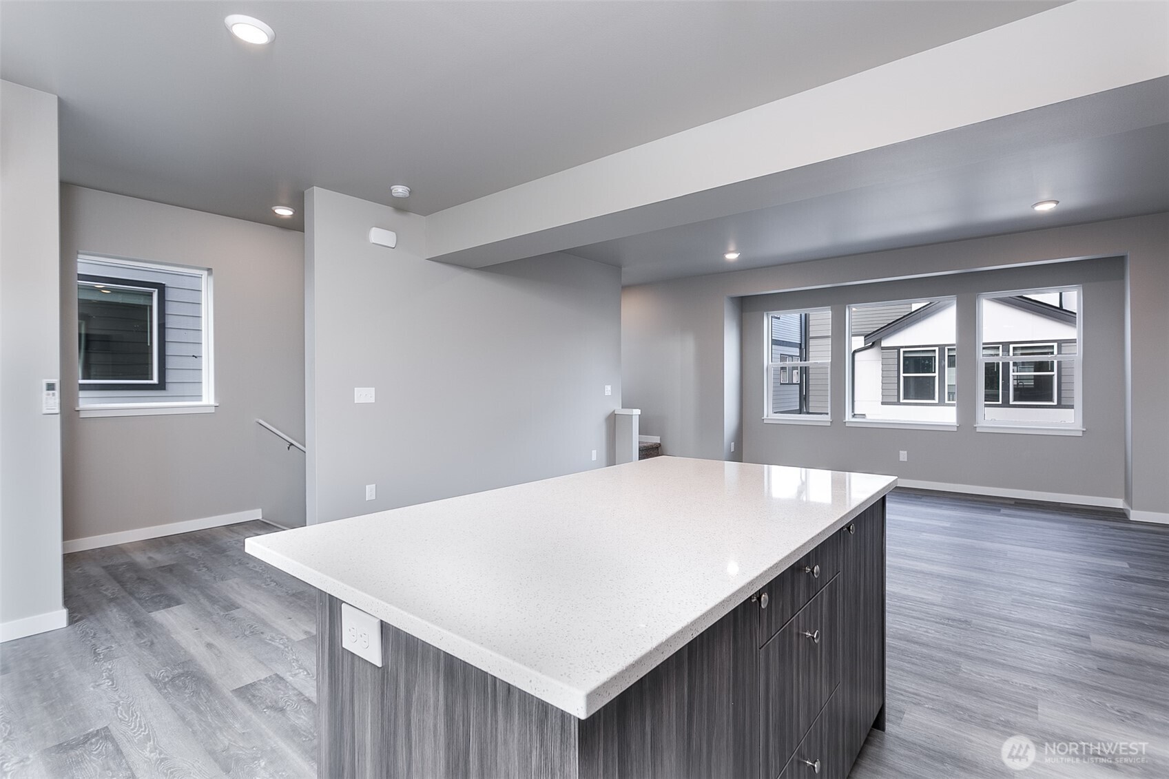 1817 Eastgate Loop Ferndale, WA 98248 - Photo 2 of 32 a kitchen with a stove a counter space and wooden floor