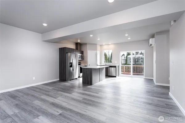a view of a kitchen with wooden floor