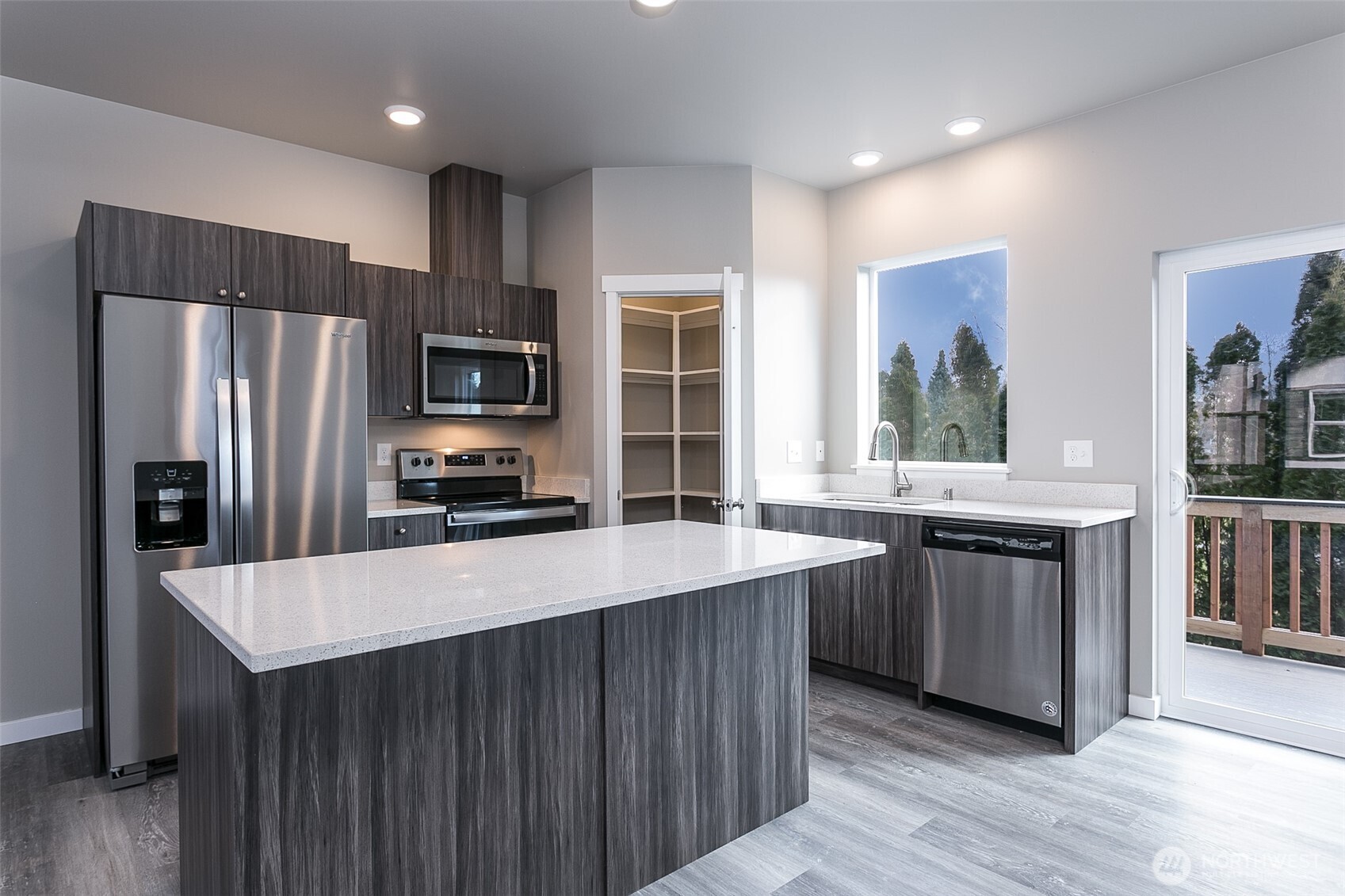 1817 Eastgate Loop Ferndale, WA 98248 - Photo 5 of 32 a kitchen with stainless steel appliances a refrigerator and a stove top oven