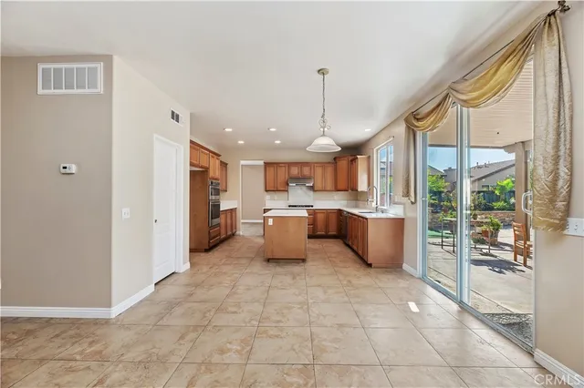 a open kitchen with stainless steel appliances granite countertop a sink and cabinets
