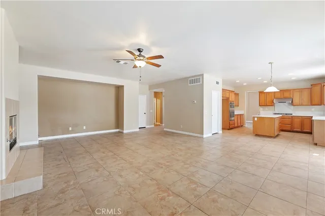 a view of a livingroom with a kitchen
