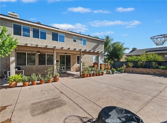 a front view of a house with sitting area