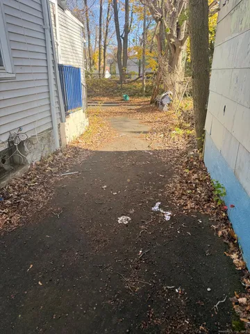 a view of house with backyard