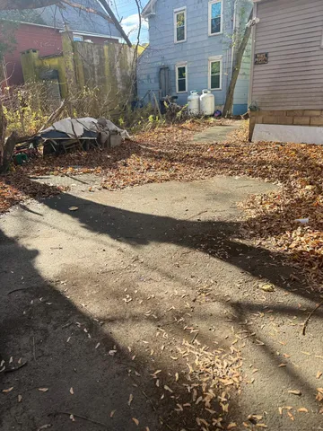 a view of a backyard of the house
