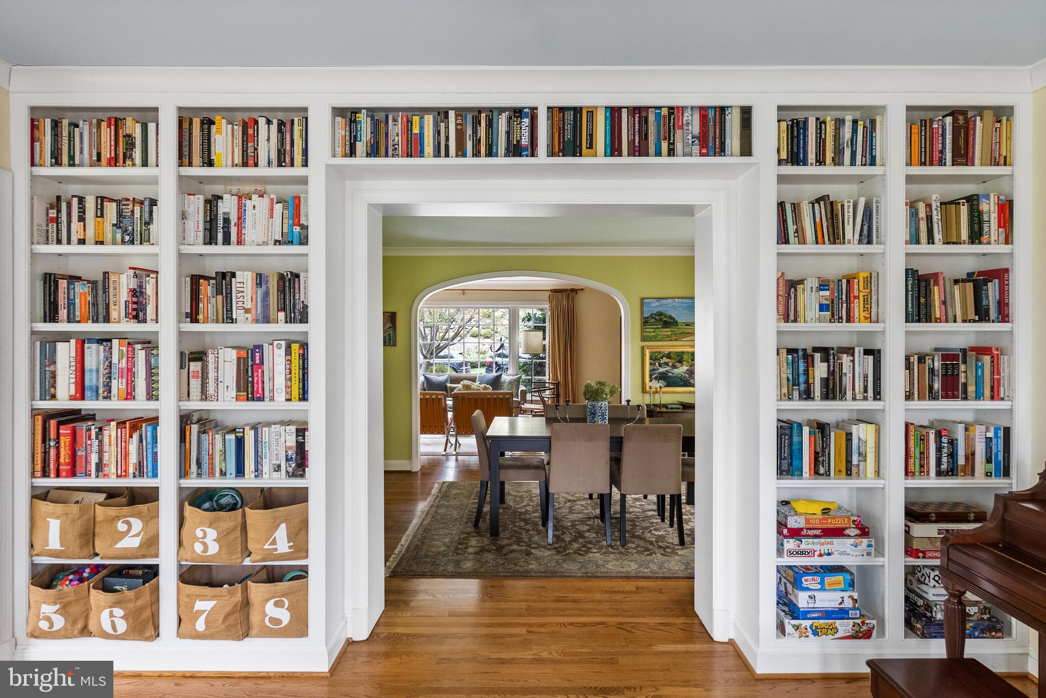 5202 Portsmouth Road Bethesda, MD 20816 - Photo 12 of 43 a living room with a book shelf and a book shelf