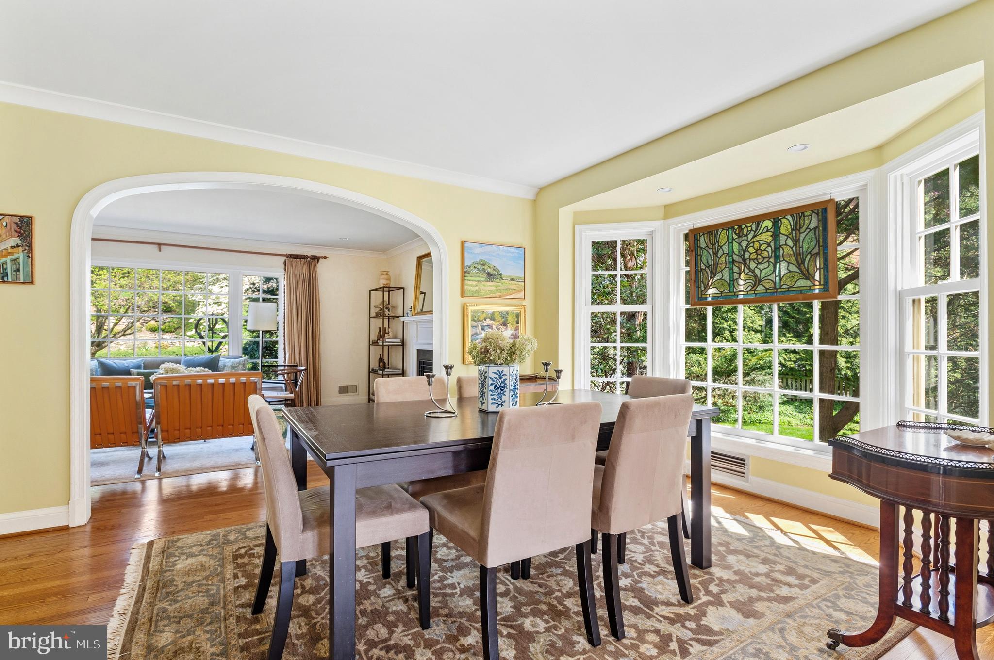 5202 Portsmouth Road Bethesda, MD 20816 - Photo 16 of 43 a view of a dining room with furniture window and wooden floor