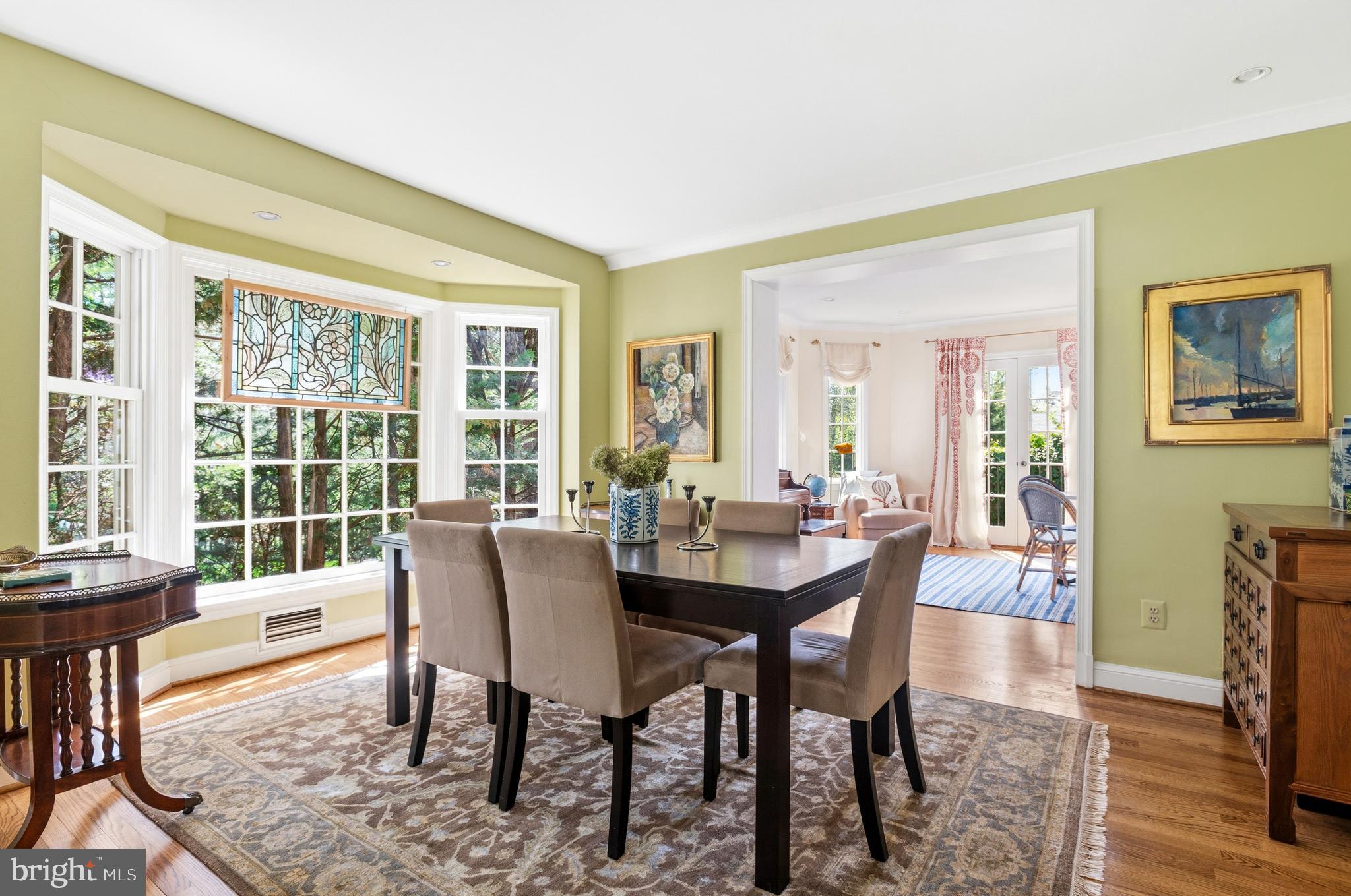 5202 Portsmouth Road Bethesda, MD 20816 - Photo 17 of 43 a view of a dining room with furniture window and wooden floor