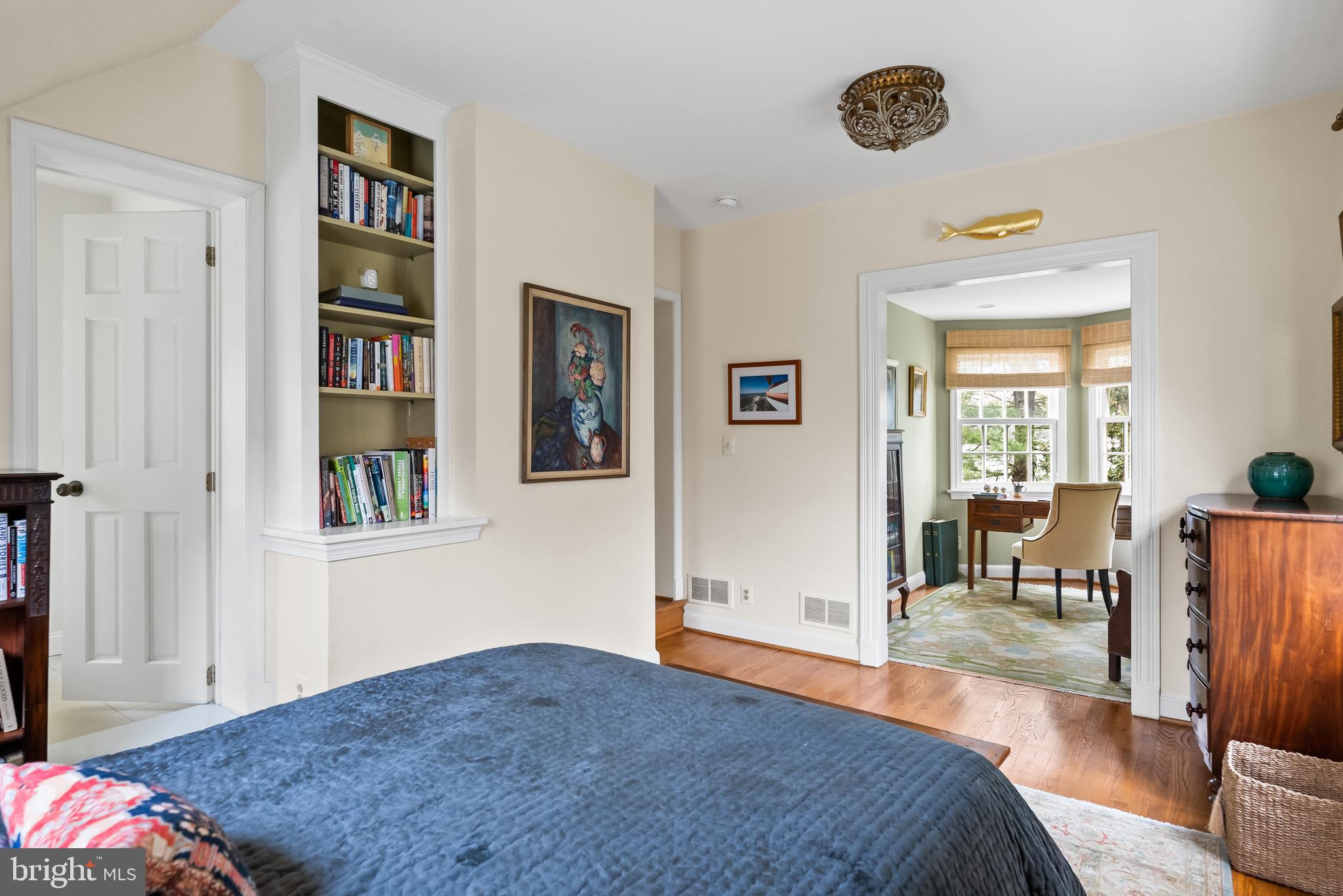 5202 Portsmouth Road Bethesda, MD 20816 - Photo 23 of 43 a bedroom with furniture and a book shelf