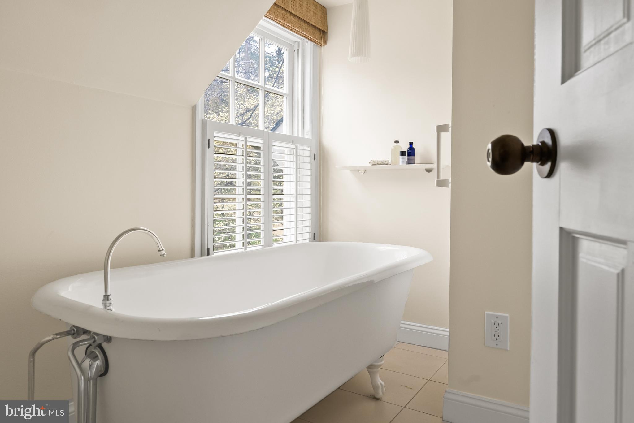 5202 Portsmouth Road Bethesda, MD 20816 - Photo 26 of 43 a bath tub sitting next to a window