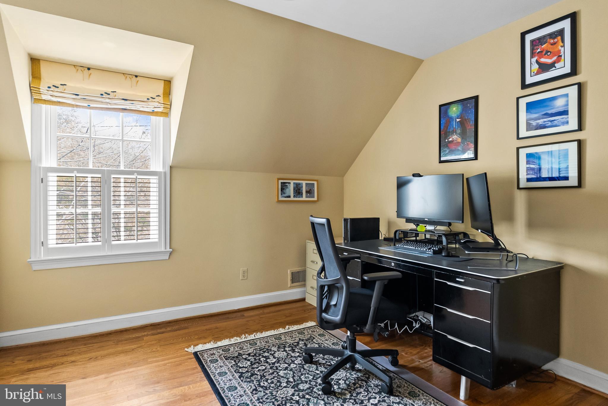 5202 Portsmouth Road Bethesda, MD 20816 - Photo 30 of 43 a view of a workspace with furniture and a window