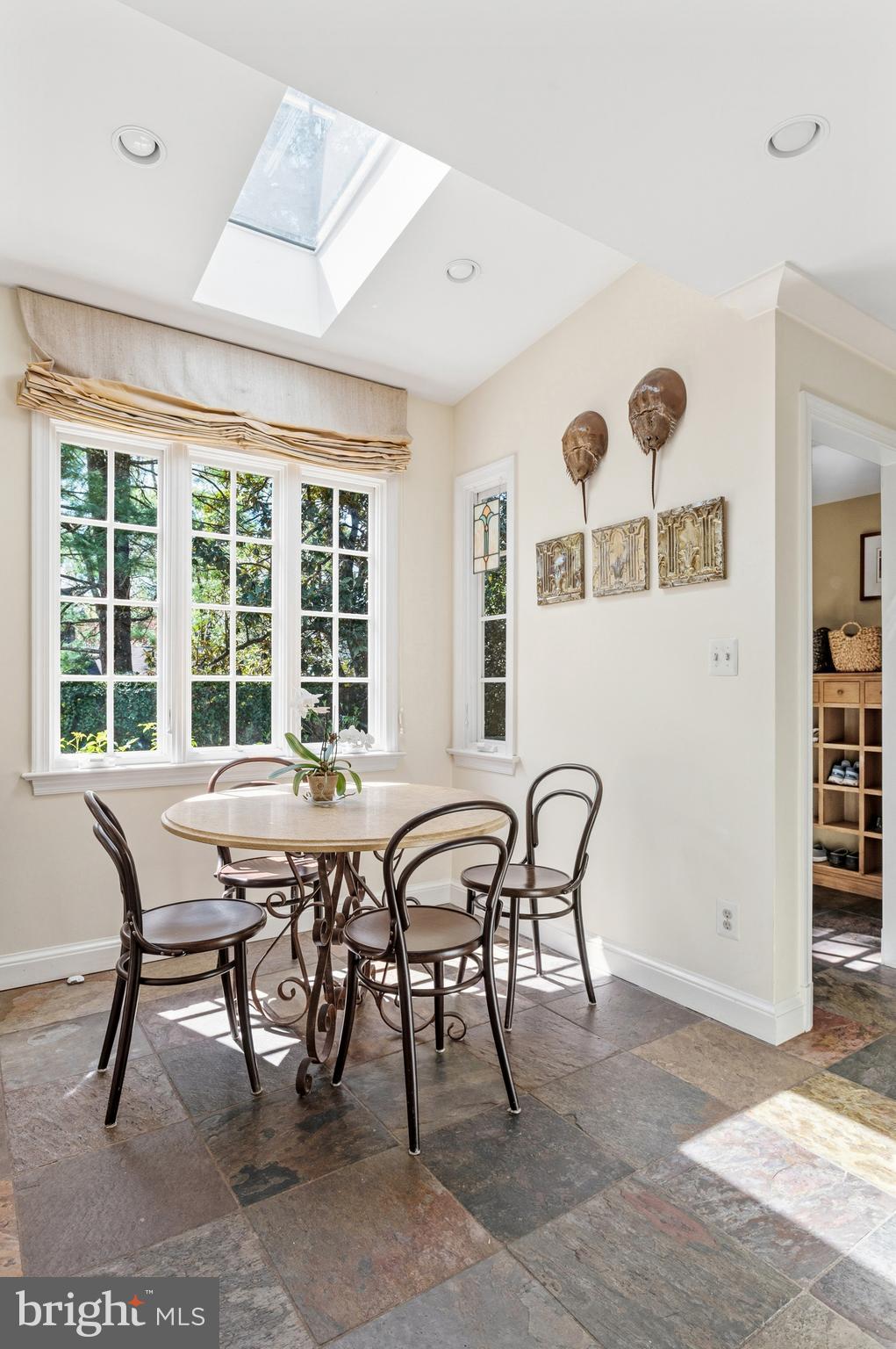 5202 Portsmouth Road Bethesda, MD 20816 - Photo 10 of 43 a view of a dining room with furniture and window