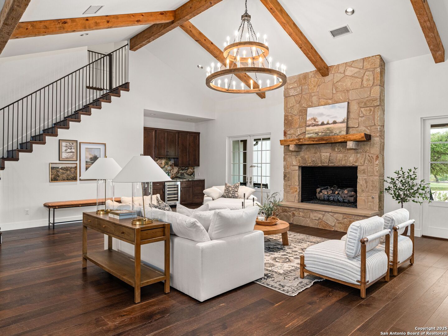 862 Grape Creek Road Fredericksburg, TX 78624 - Photo 18 of 90 a living room with furniture a fireplace and a large window