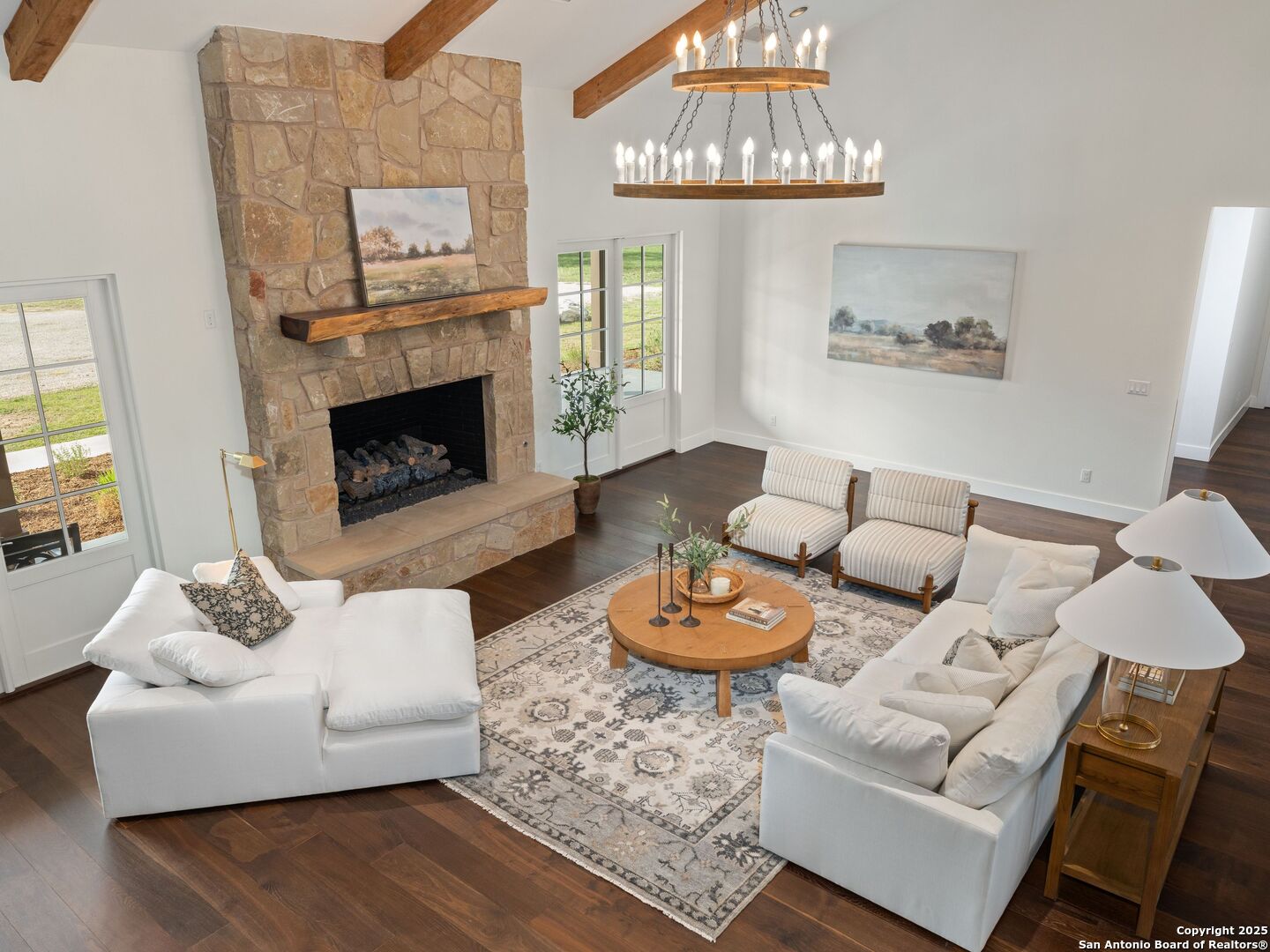 862 Grape Creek Road Fredericksburg, TX 78624 - Photo 19 of 90 a living room with furniture and a fireplace