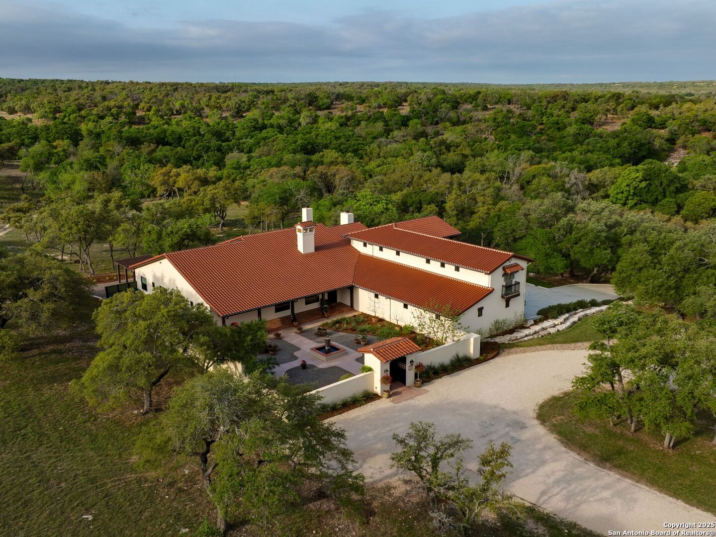 862 Grape Creek Road Fredericksburg, TX 78624 - Photo 2 of 90 an aerial view of a house with a garden