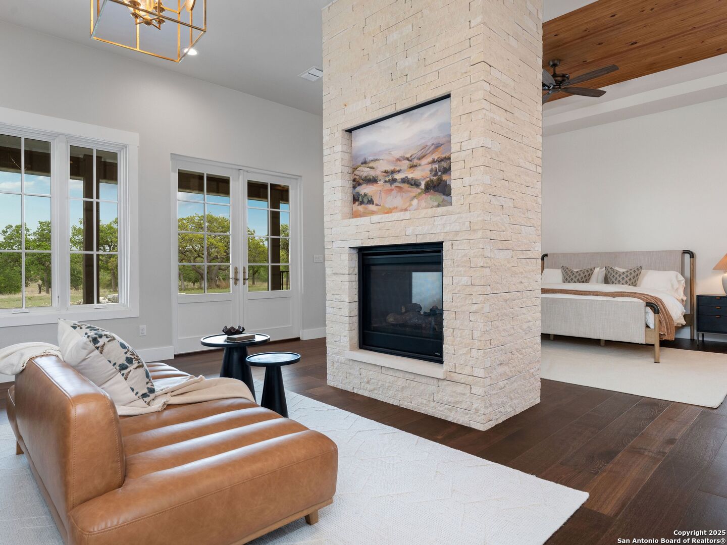 862 Grape Creek Road Fredericksburg, TX 78624 - Photo 30 of 90 a living room with furniture and a fireplace