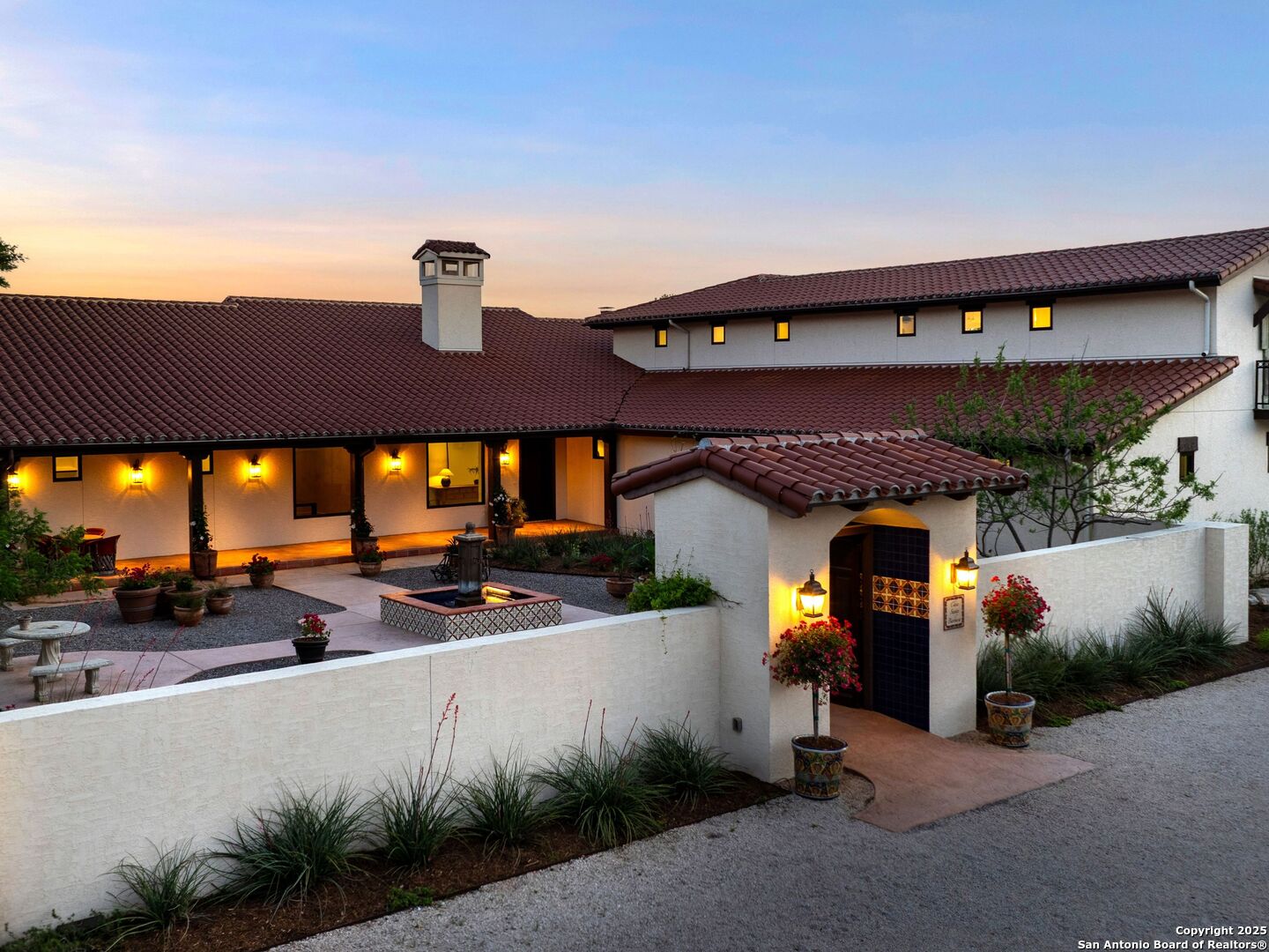 862 Grape Creek Road Fredericksburg, TX 78624 - Photo 39 of 90 a view of a patio with table and chairs under an umbrella