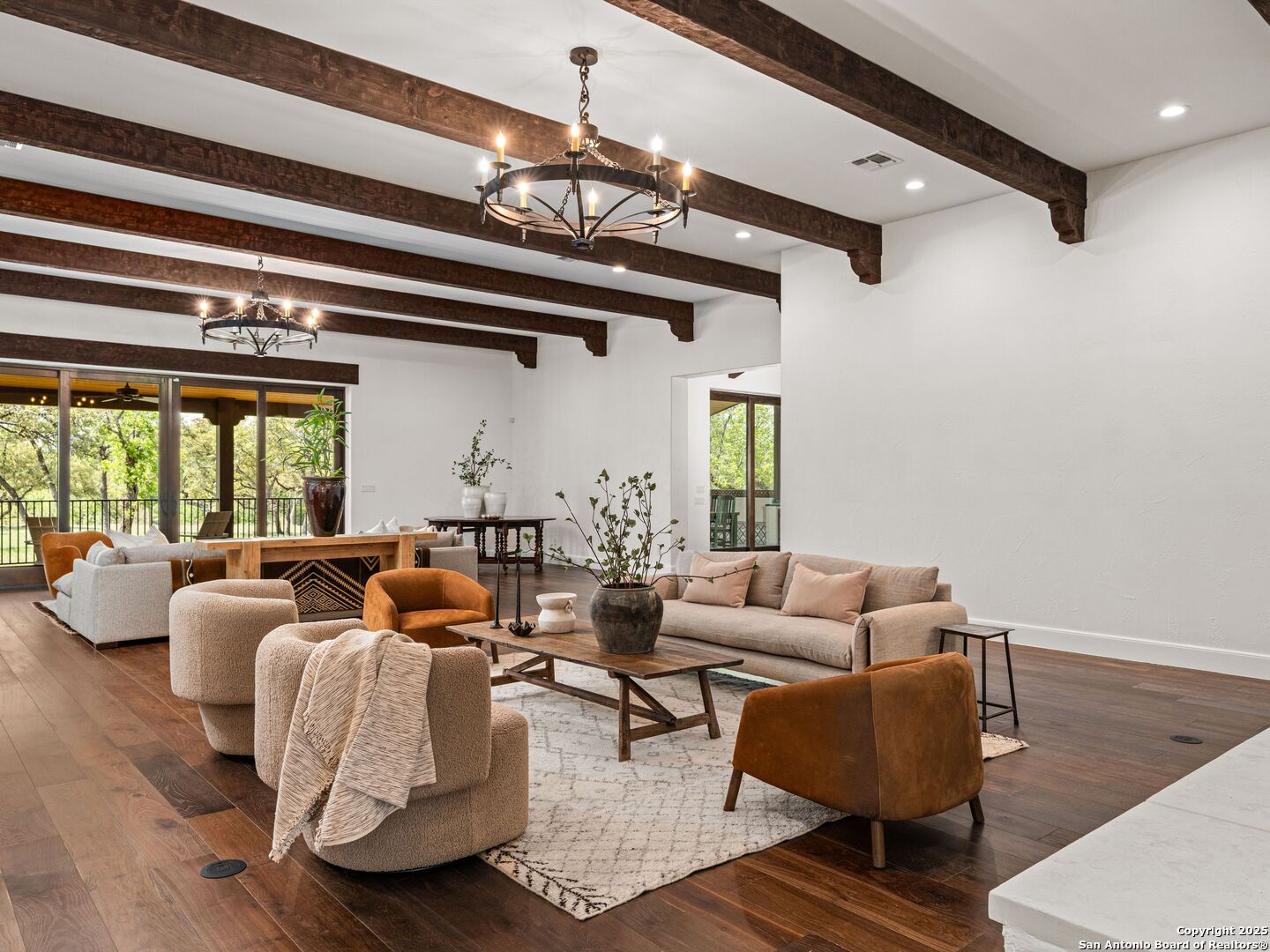 862 Grape Creek Road Fredericksburg, TX 78624 - Photo 56 of 90 a living room with furniture and a chandelier