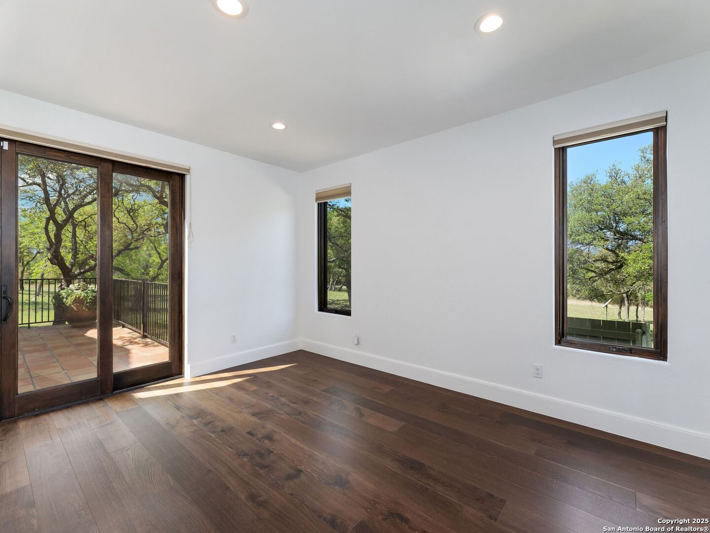 862 Grape Creek Road Fredericksburg, TX 78624 - Photo 69 of 90 a view of an empty room with wooden floor and a window