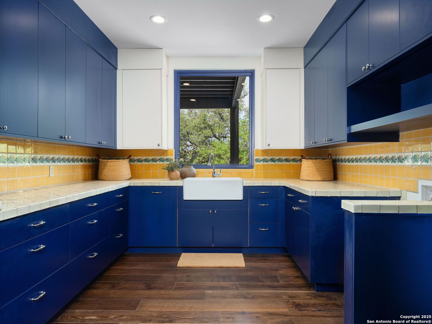 862 Grape Creek Road Fredericksburg, TX 78624 - Photo 70 of 90 a kitchen with wooden cabinets and sink