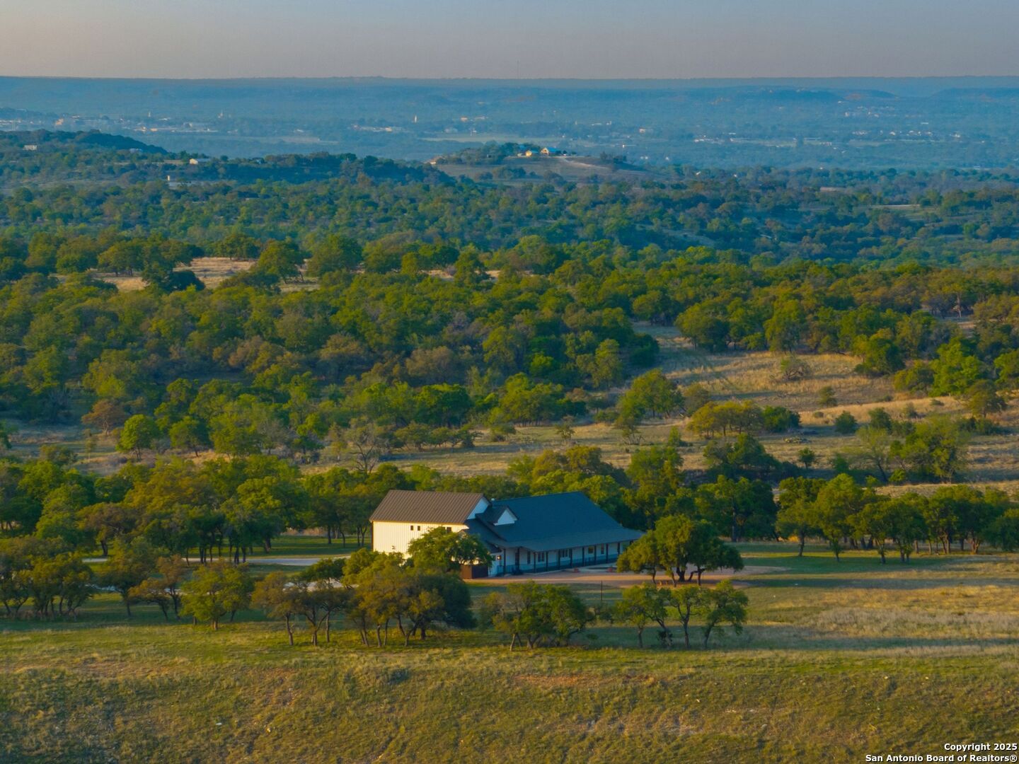 862 Grape Creek Road Fredericksburg, TX 78624 - Photo 77 of 90 a view of a town with mountains in the background